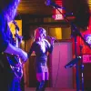 A live band performs on stage at a Red River venue during the Red River Jamboree.