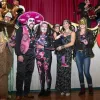 Costumed Krewe de VooDoo Ball guests in skeleton face paint celebrate Lundi Gras in Red River.