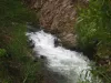 The Red River rushing through a rocky canyon pinch near Red River, New Mexico.
