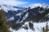 Snow-covered slopes and a lift station at Taos Ski Valley in the Sangre de Cristo Mountains.