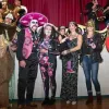 Costumed revelers pose at the Mardi Gras in the Mountains ball in Red River.
