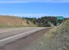 The Bobcat Pass summit sign on NM-38 at 9,820 feet on the Continental Divide above Red River.