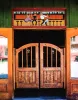 The swinging wooden doors of the Bull O' the Woods Saloon on Main Street in Red River.