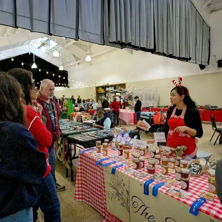 Shoppers browse the stalls at Red River's Christmas holiday market.